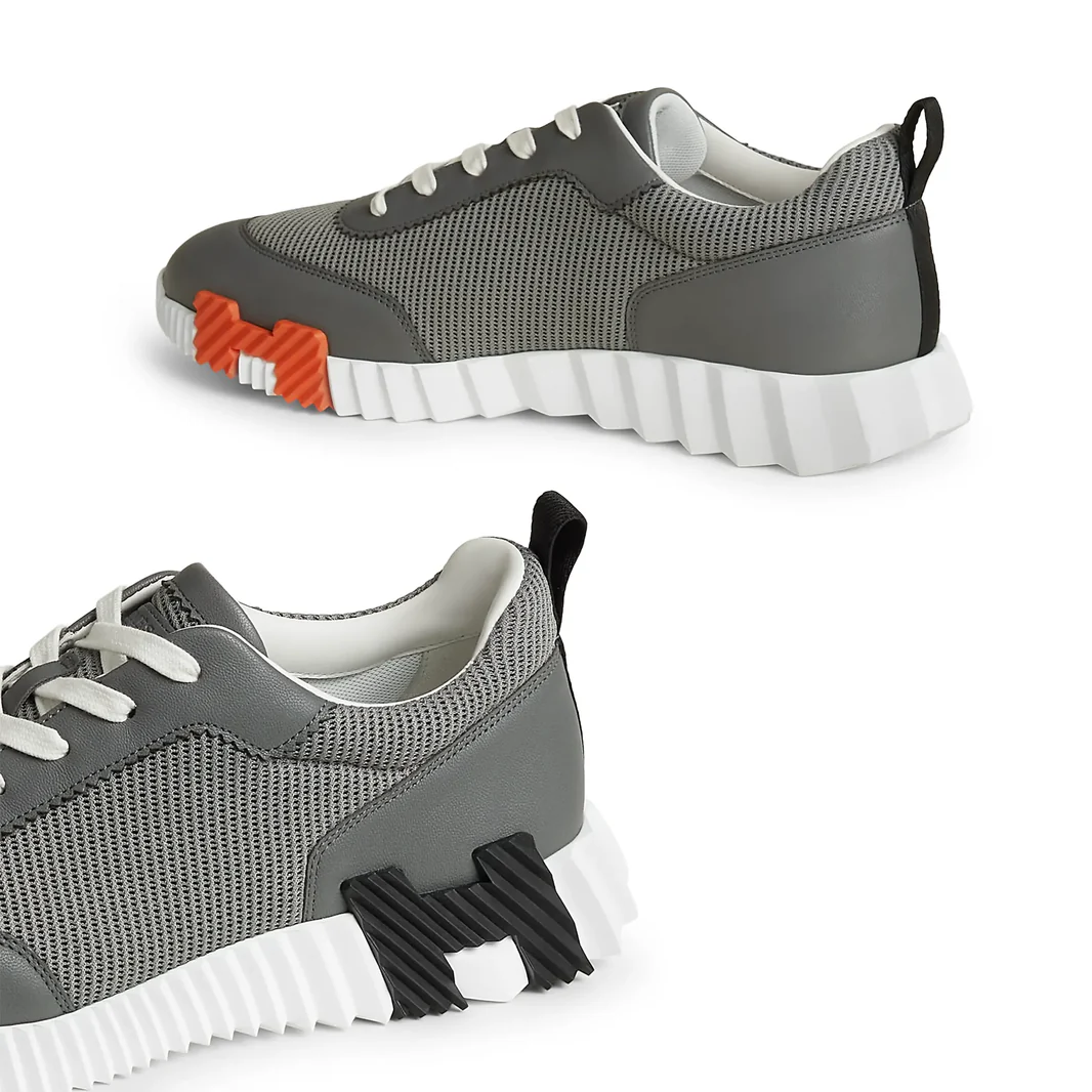 hermes-paris-bouncing-sneaker-osmium-grey-h261897zh67410-side_88ed812e-73ef-448a-89a7-b05ee6c11ea4